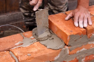 Mason building brick wall